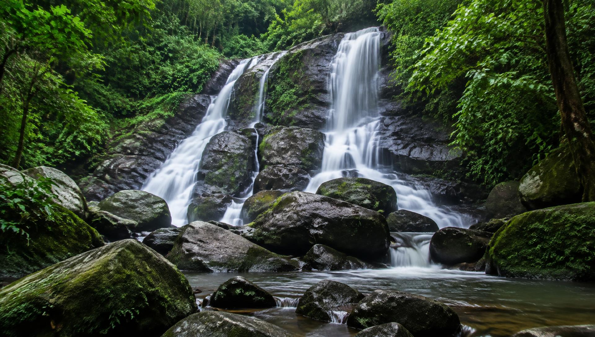 Waterfall cascading through dense forest near Maredumilli